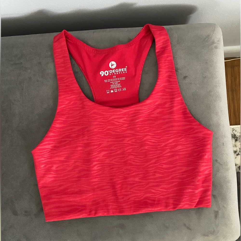 Red workout top with subtle zebra print